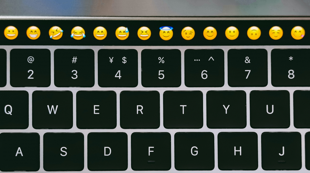 Emojis on top bar of laptop