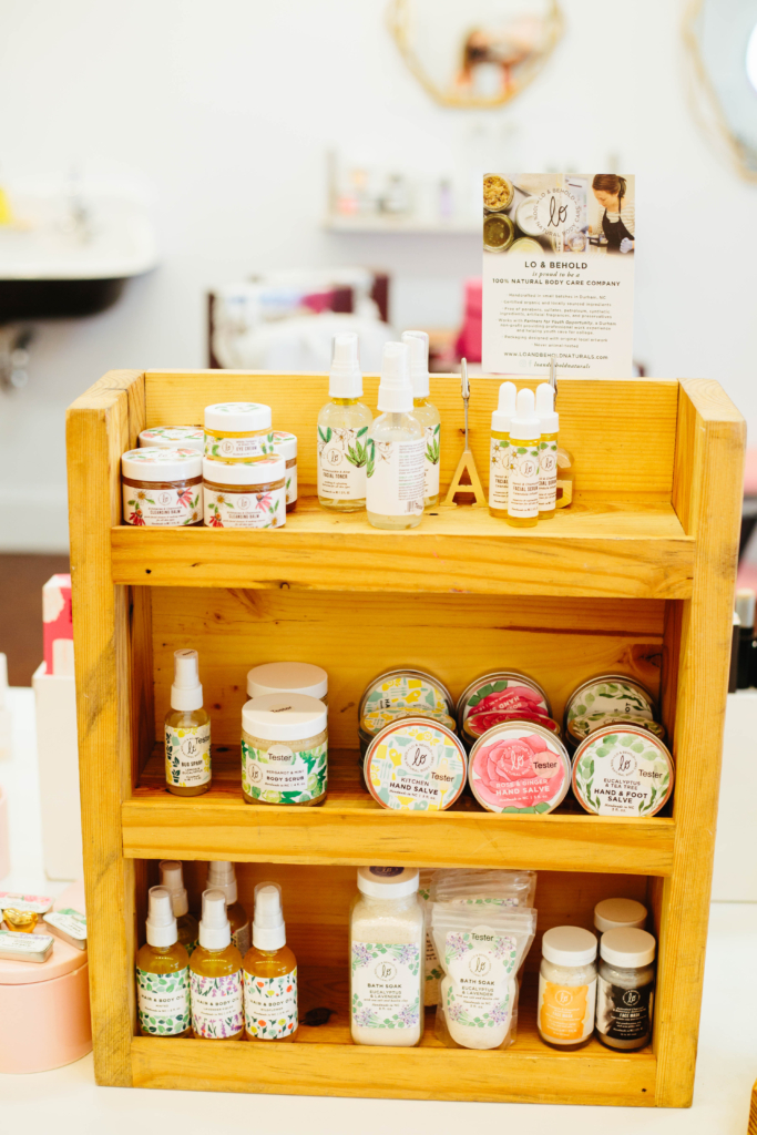 Photo of Lo & Behold display made of reclaimed wood with natural products on it